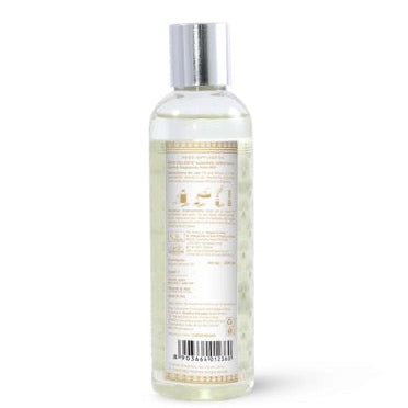 Bottle of reed oil with a label on a white background